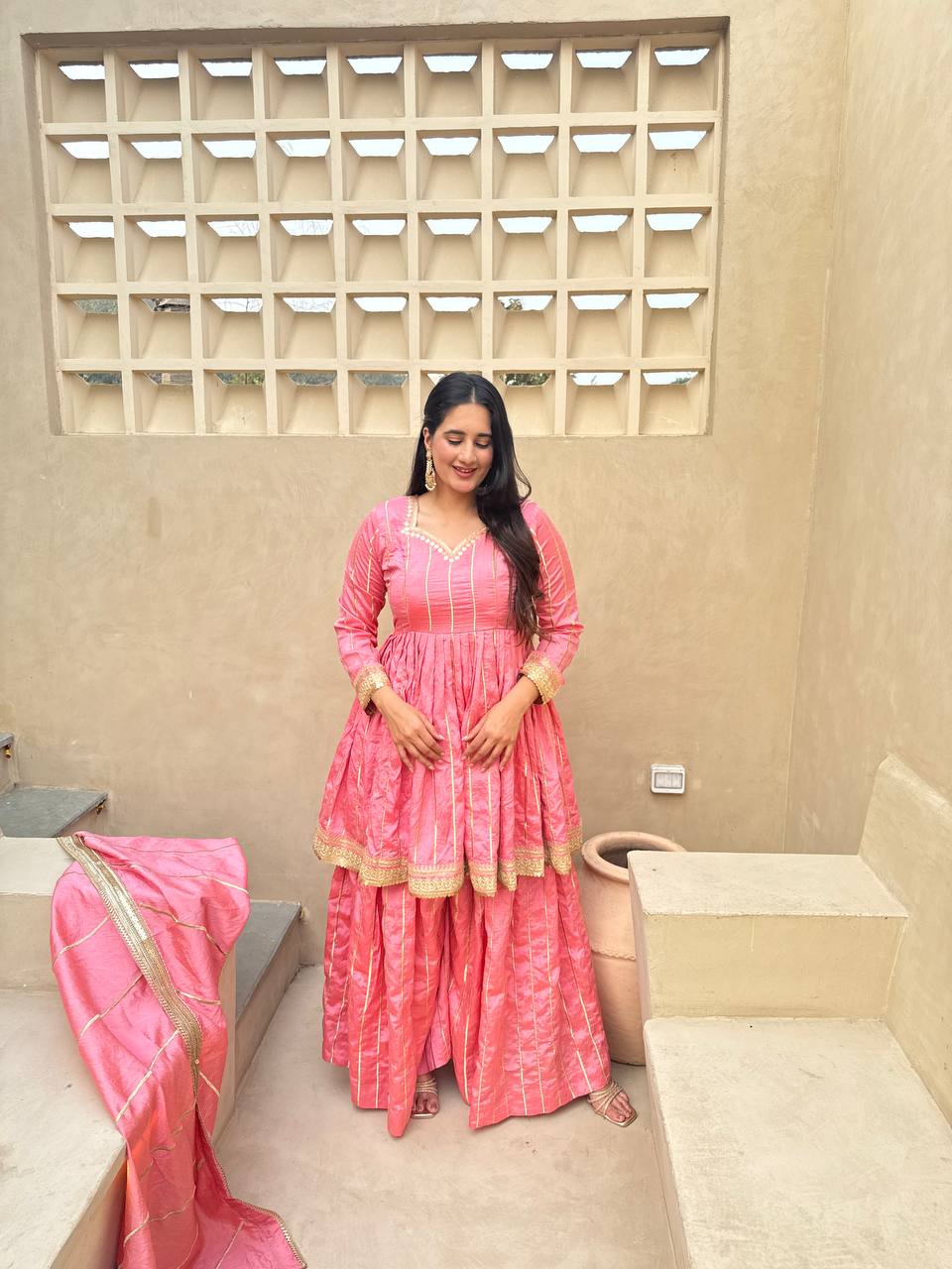 Radiant Rose Pink Flared Peplum Kurti and Sharara Set Embellished with Luminous Gold Zari Stripes and Sequined Borders